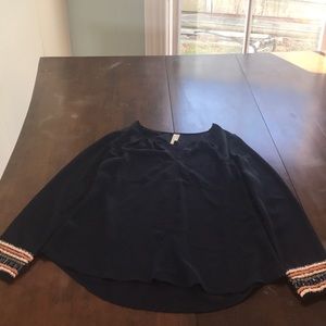 Blue blouse with beaded detail on the sleeves